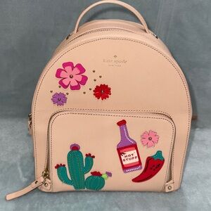 kate spade Beige Backpack with Floral and Cactus Patches.